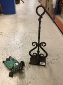 A wrought iron door porter 40.5 cm high together with a Victorian wrought iron boot jack (jack