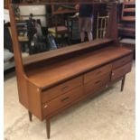 A G Plan teak dressing chest with mirrored superstructure over a bank of six drawers on turned