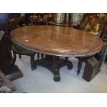 A Victorian rosewood centre table, the oval top wi