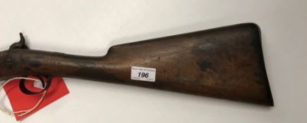 A 19th Century hammer action muzzle loading rifle with walnut stock 109 cm long over all (Requires