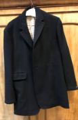 A gentlemen's blue hunt coat with VWH buttons (one missing)Condition ReportThe length of the coat is