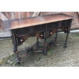 An early 20th Century oak side table in the 17th Century manner, the quarter cut oak top with