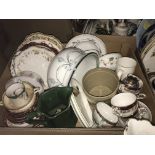Two boxes of assorted decorative china wares to include various decorative plates, chamber pot, etc