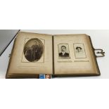 Two Victorian leather bound photo albums containing various Victorian and later photographs, the