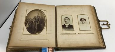 Two Victorian leather bound photo albums containing various Victorian and later photographs, the