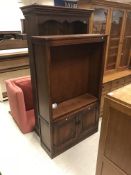 A modern mahogany bookcase cabinet with three glaz