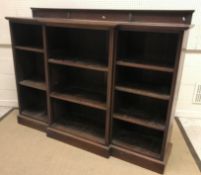 A circa 1900 mahogany breakfront open bookcase with adjustable shelving and shallow raised back, 176