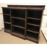 A circa 1900 mahogany breakfront open bookcase with adjustable shelving and shallow raised back, 176