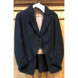 A black side saddle hunt coat by Roberts & Carroll Limited Cork Street London, approx size 10