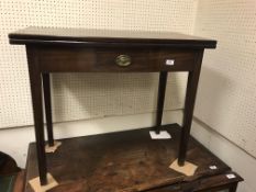 A 19th Century mahogany tea table in the Provincial Chippendale taste, the plain top opening to