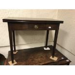 A 19th Century mahogany tea table in the Provincial Chippendale taste, the plain top opening to