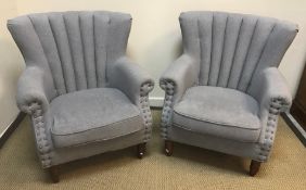 A pair of Warmiehomy pale blue upholstered scroll arm chairs, 76 cm wide x 53 cm deep x 88 cm