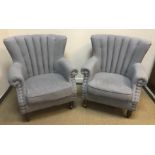 A pair of Warmiehomy pale blue upholstered scroll arm chairs, 76 cm wide x 53 cm deep x 88 cm