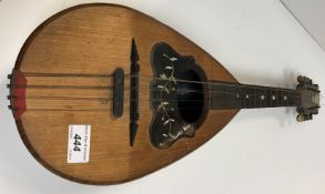 An Italian mandolin by Michele Meglio of Napoli with label to interior and stamp to the pine front