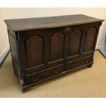 A late 18th Century oak mule chest, the rising top