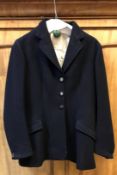 A blue hunt coat by Bernard Wetherill of Conduit Street London with VWH moulded buttons, approx size