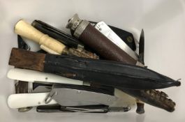 A collection of twenty pen and sheath knives, together with a small collection of various first