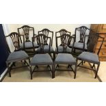 A set of eight early 20th Century mahogany Hepplewhite style dining chairs with pierced back
