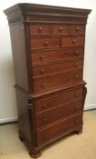 A modern mahogany chest on chest in the Georgian style, the moulded cornice above a blind fretwork