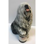 A Beswick model of "Old English Sheepdog with paw raised on Dulux Gloss Finish paint tin", 31 cm