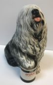 A Beswick model of "Old English Sheepdog with paw raised on Dulux Gloss Finish paint tin", 31 cm