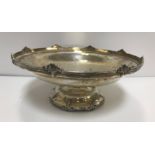 A George V silver pedestal dish with stylised shell decoration (by Walker & Hall, Sheffield 1937),