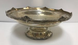 A George V silver pedestal dish with stylised shell decoration (by Walker & Hall, Sheffield 1937),