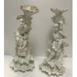 A pair of 19th Century Dresden blanc de chine candle holders,