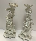 A pair of 19th Century Dresden blanc de chine candle holders,