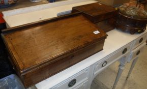 An early 19th Century mahogany and cross-banded table top writing chest with reading slope top