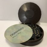A vintage Bakelite domino set in circular fanned case together with original instructions (probably