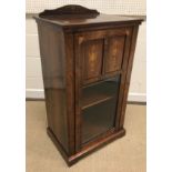 A late Victorian rosewood and marquetry inlaid music cabinet,