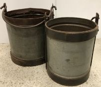 Two large galvanised and studded steel swing handled buckets largest 35 cm high