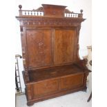 An Italian walnut carved Gothic Revival style hall settle,