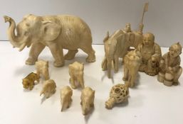 A collection of late 19th and early 20th Century carved ivory items including two Japanese ivory