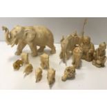 A collection of late 19th and early 20th Century carved ivory items including two Japanese ivory