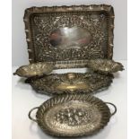 A pair of pierced silver bonbon dishes with scrolling foliate decoration raised on pedestal bases