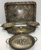 A pair of pierced silver bonbon dishes with scrolling foliate decoration raised on pedestal bases