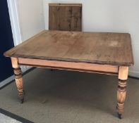 A Victorian oak rectangular extending dining table, the top with moulded edge and single extra leaf,