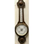 A circa 1900 carved oak cased aneroid barometer with mercury thermometer 79 cm high