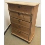 A 19th Century Continental pine chest of five long drawers on turned feet,