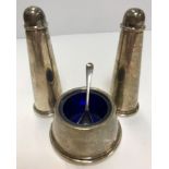 A modern silver three-piece cruet of tapered conical form comprising salt,