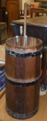 A 20th Century coopered teak metal bound cylindrical stick stand, 26 cm diameter x 61.