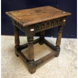 A 20th Century joined oak stool in the 17th Century style,