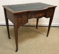 An Edwardian rosewood and inlaid writing table,
