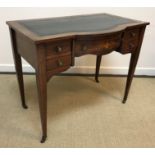 An Edwardian rosewood and inlaid writing table,