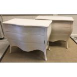 A pair of modern white lacquered commodes of bombe serpentine form,