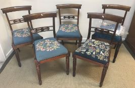 A set of five Victorian rosewood bar back dining chairs with drop-in seats on turned and reeded