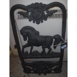 A modern cast iron stable window with horse decoration