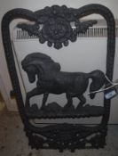 A modern cast iron stable window with horse decoration